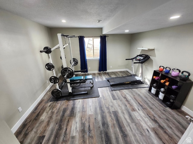 9362 N Sunnyvale Dr, Eagle Mountain, UT 84005 - workout area with wood finished floors, a textured ceiling, baseboards, and recessed lighting