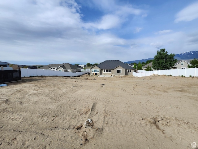 9362 N Sunnyvale Dr, Eagle Mountain, UT 84005 - view of yard with fence and a mountain view