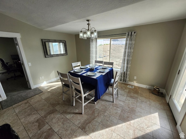 9362 N Sunnyvale Dr, Eagle Mountain, UT 84005 - dining area featuring a chandelier, baseboards, a desk, and a textured ceiling
