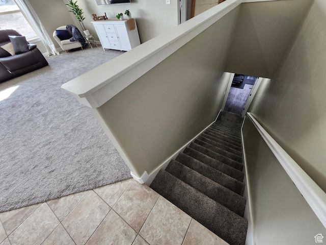 9362 N Sunnyvale Dr, Eagle Mountain, UT 84005 - stairway with carpet floors and tile patterned flooring