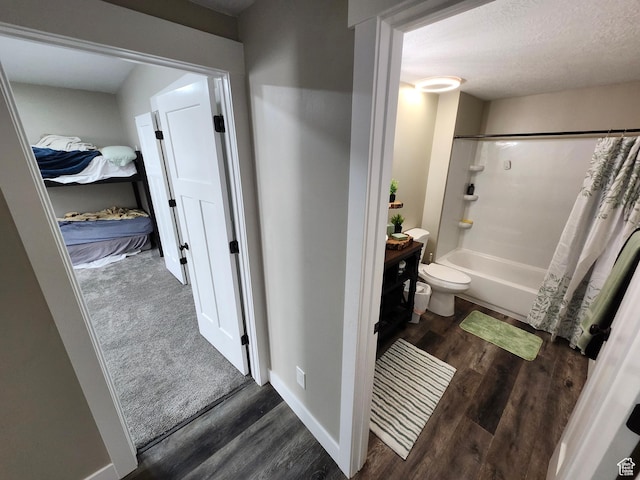 9362 N Sunnyvale Dr, Eagle Mountain, UT 84005 - full bathroom with wood finished floors, shower / bathtub combination with curtain, toilet, and vanity
