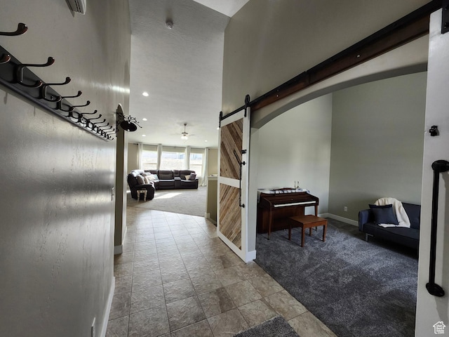 9362 N Sunnyvale Dr, Eagle Mountain, UT 84005 - corridor featuring a barn door, baseboards, carpet, and recessed lighting