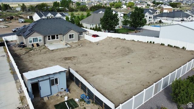 9362 N Sunnyvale Dr, Eagle Mountain, UT 84005 - fenced backyard with a residential view and an outdoor structure