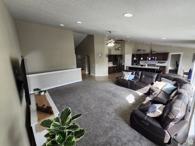 9362 N Sunnyvale Dr, Eagle Mountain, UT 84005 - living room featuring lofted ceiling, recessed lighting, a ceiling fan, a textured ceiling, and baseboards