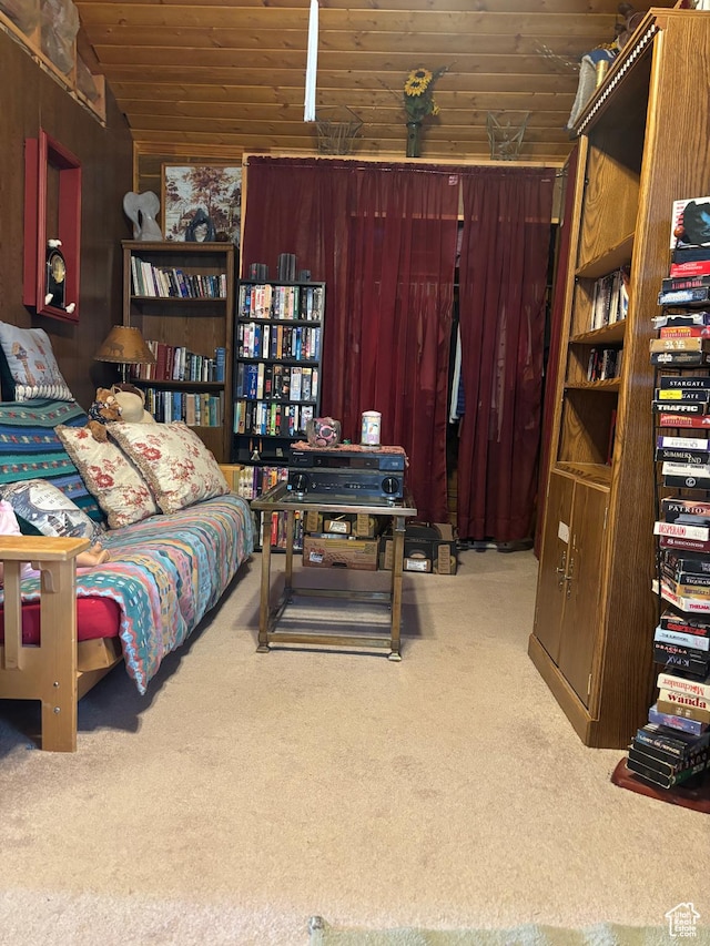 carpeted bedroom with vaulted ceiling and wood ceiling