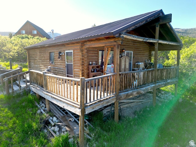 11775 E 14270 N, Mount Pleasant, UT 84647 - back of property with log siding, a deck, and metal roof