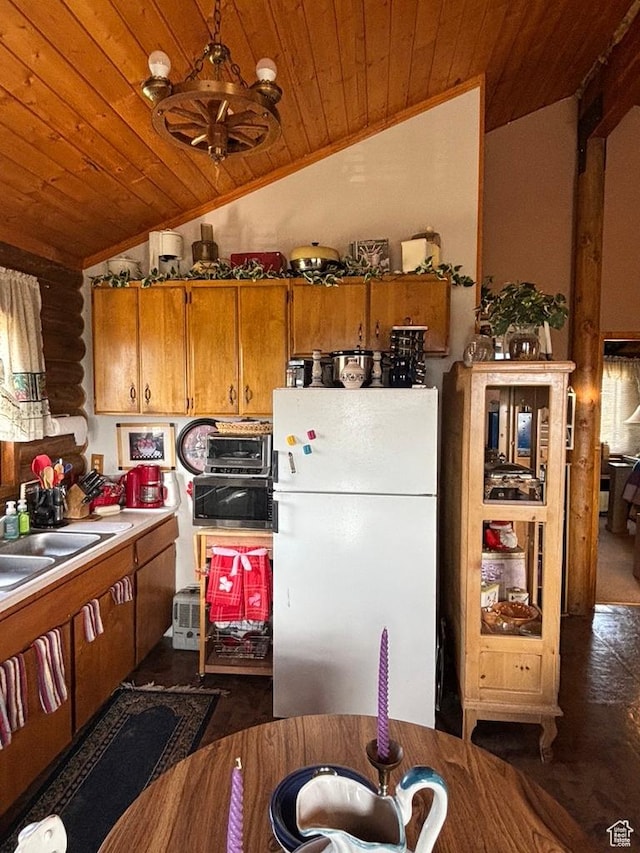 11775 E 14270 N, Mount Pleasant, UT 84647 - kitchen with freestanding refrigerator, wood ceiling, lofted ceiling, brown cabinets, and a sink