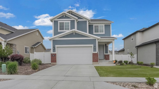 3734 W 2750 N, Lehi, UT 84043 - view of front of home featuring an attached garage, brick siding, board and batten siding, and concrete driveway