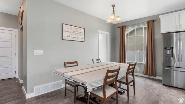 3734 W 2750 N, Lehi, UT 84043 - dining area with wood finished floors, baseboards, and a chandelier