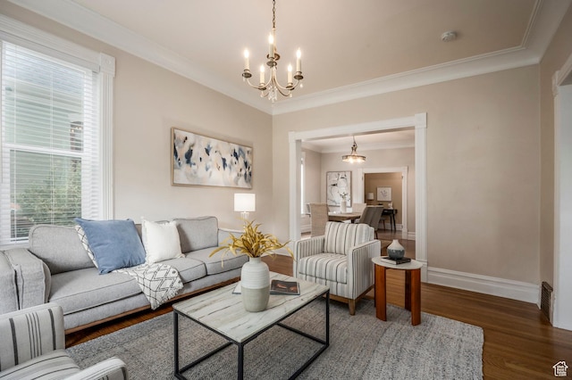 914 E 1st Ave, Salt Lake City, UT 84103 - living area with a chandelier, ornamental molding, baseboards, wood finished floors, and plenty of natural light