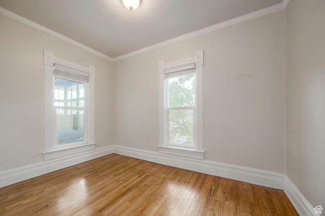 914 E 1st Ave, Salt Lake City, UT 84103 - empty room featuring healthy amount of natural light, light wood-type flooring, ornamental molding, and baseboards