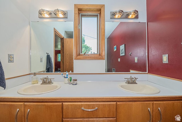 bathroom featuring double vanity