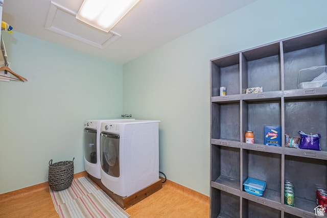 laundry area featuring attic access and independent washer and dryer