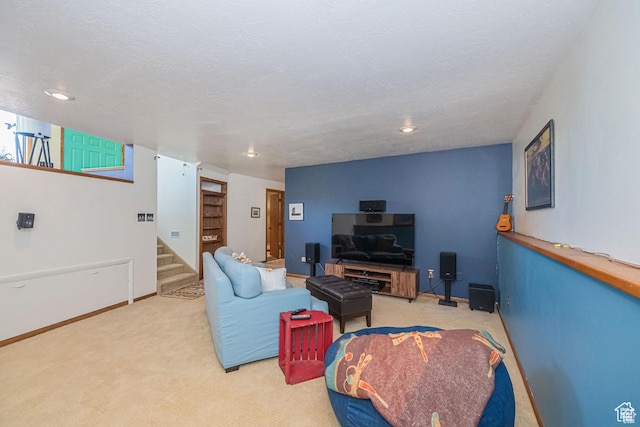 living area featuring carpet floors, stairs, baseboards, and recessed lighting