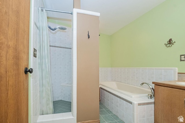 full bath featuring tiled shower, a garden tub, tile patterned flooring, and vanity