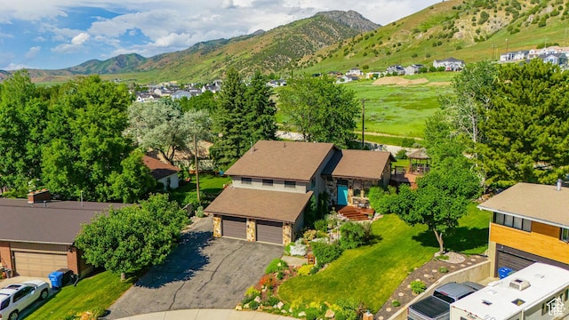 aerial view of residential area featuring mountains