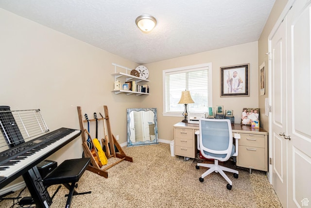 home office with a textured ceiling, light carpet, and baseboards