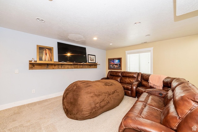 living area with carpet, recessed lighting, baseboards, and a textured ceiling
