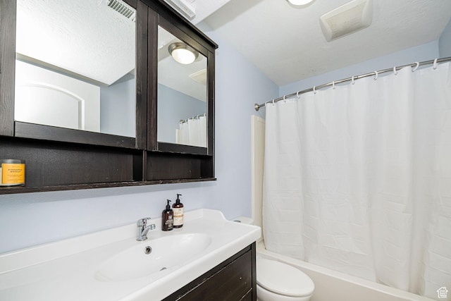bathroom featuring toilet, vanity, and shower / bath combo with shower curtain