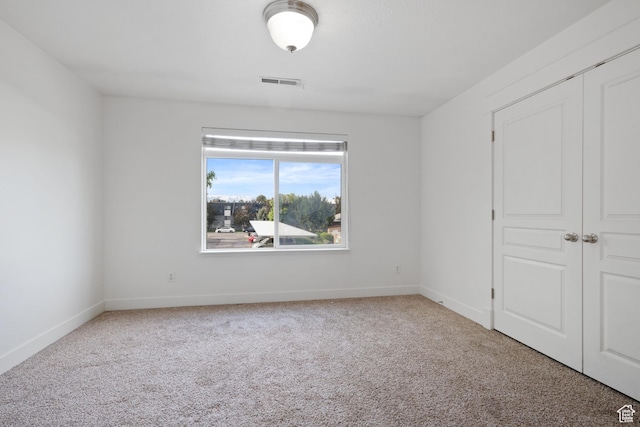 381 S State St E Unit 12, Provo, UT 84606 - unfurnished bedroom featuring carpet, baseboards, and a closet