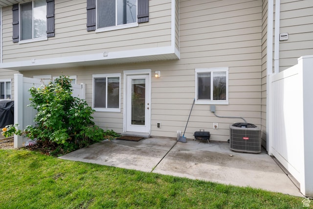 381 S State St E Unit 12, Provo, UT 84606 - rear view of property featuring central air condition unit, a patio, and a yard