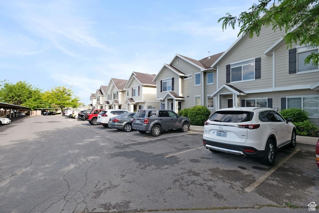381 S State St E Unit 12, Provo, UT 84606 - uncovered parking lot featuring a residential view