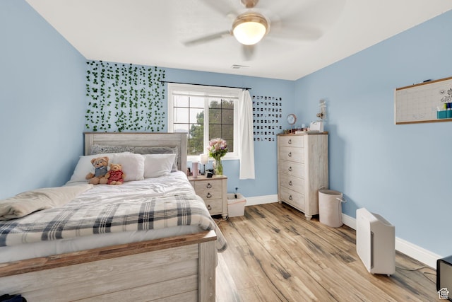 13856 S Cromwell Ln E, Draper, UT 84020 - bedroom with wood finished floors, baseboards, and a ceiling fan
