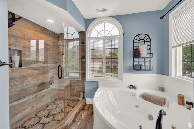 13856 S Cromwell Ln E, Draper, UT 84020 - bathroom featuring a shower stall, a tub with jets, and wood finished floors