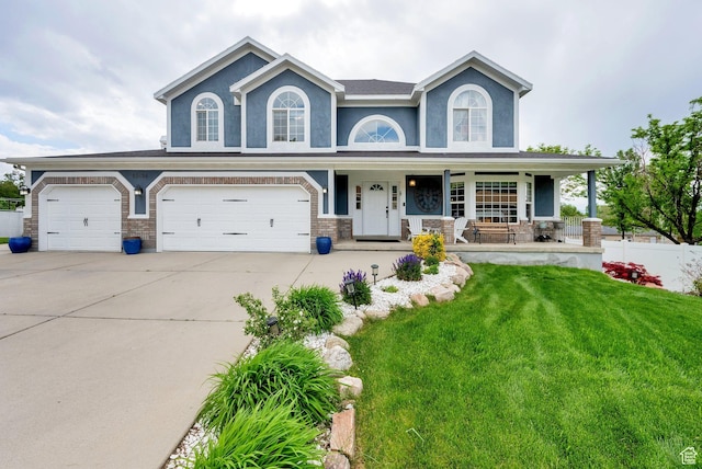 13856 S Cromwell Ln E, Draper, UT 84020 - view of front facade with covered porch, concrete driveway, and a garage