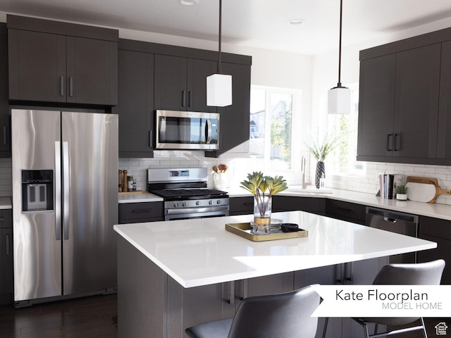 1051 N 3685 W Unit 250, Lehi, UT 84043 - kitchen featuring appliances with stainless steel finishes, a breakfast bar area, decorative backsplash, and recessed lighting