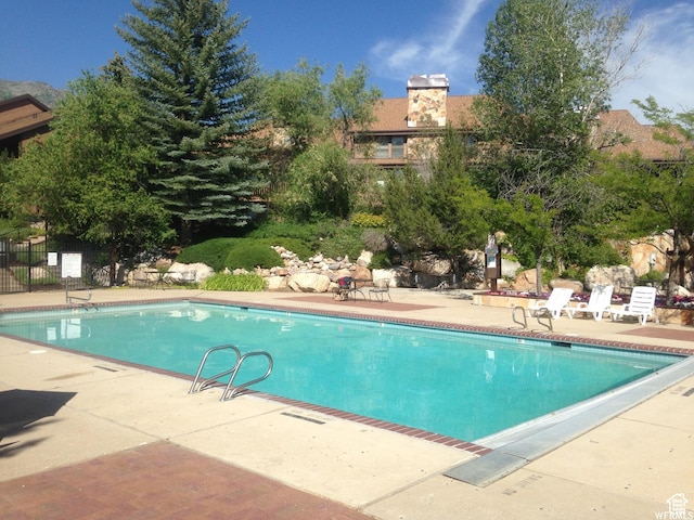 3615 N Wolf Lodge Dr Unit 1109, Eden, UT 84310 - view of swimming pool with a patio area and fence