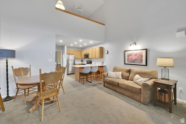 3615 N Wolf Lodge Dr Unit 1109, Eden, UT 84310 - living room featuring baseboards, light colored carpet, ceiling fan, recessed lighting, and a high ceiling