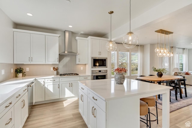 1476 W Cook Ln N Unit 162, Farmington, UT 84025 - kitchen with wall chimney exhaust hood, appliances with stainless steel finishes, plenty of natural light, light wood-type flooring, and recessed lighting