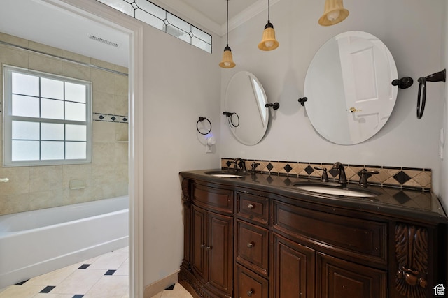 bathroom with tile patterned floors, double vanity, ornamental molding, and bathtub / shower combination