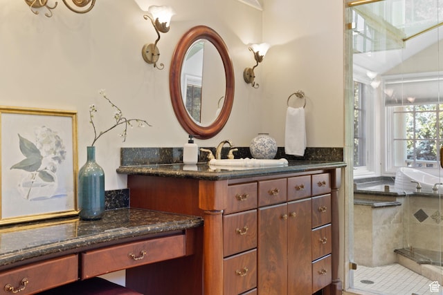 bathroom with vanity and a shower stall