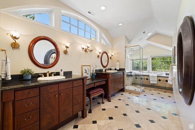 full bath with lofted ceiling, a stall shower, two vanities, and recessed lighting