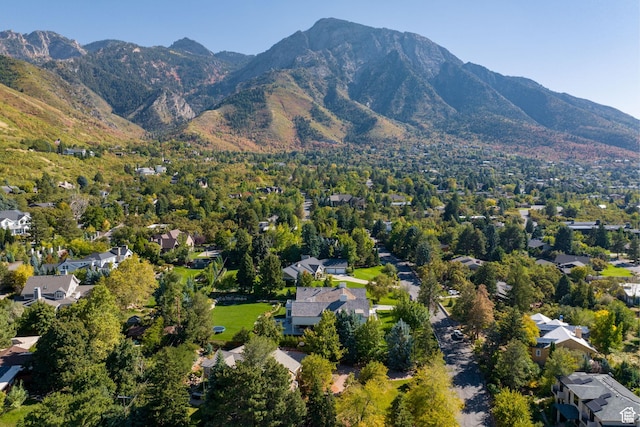 view of property location with a mountainous background and nearby suburban area