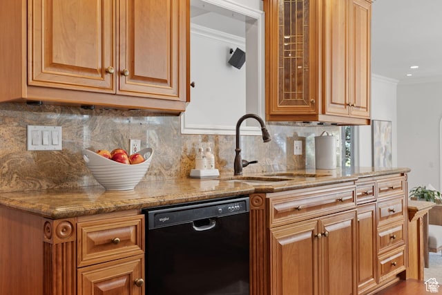 kitchen with dishwasher, a sink, ornamental molding, light stone counters, and backsplash