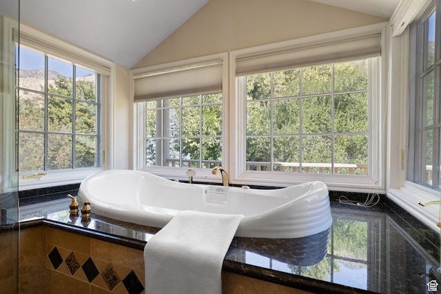 sunroom featuring lofted ceiling
