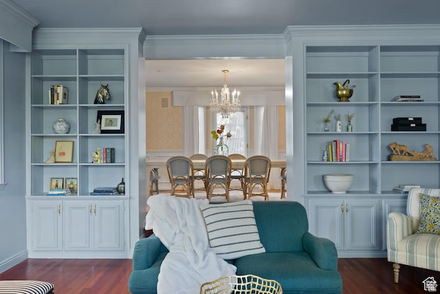 living area with a chandelier, dark wood-style flooring, built in shelves, and crown molding