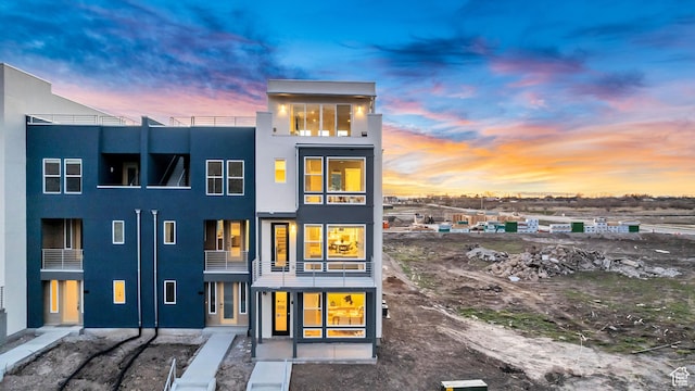 1474 W Cook Ln N Unit 163, Farmington, UT 84025 - rear view of property featuring a balcony and stucco siding