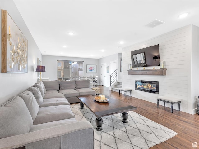 1374 Gambel Oak Way, Park City, UT 84098 - living room featuring wood finished floors, recessed lighting, a large fireplace, and stairs