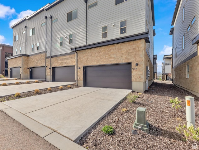 1374 Gambel Oak Way, Park City, UT 84098 - rear view of property with a garage, concrete driveway, and stone siding