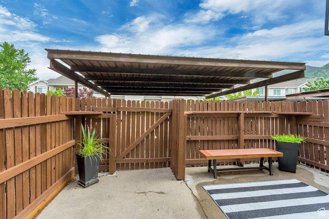 view of patio featuring fence