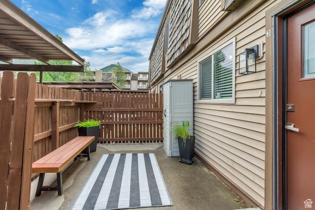 view of patio featuring fence