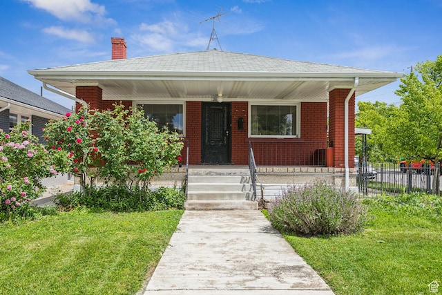 1435 S 500 E, Salt Lake City, UT 84105 - bungalow-style home featuring a porch, a chimney, and brick siding