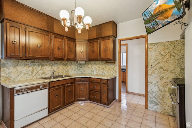 1435 S 500 E, Salt Lake City, UT 84105 - kitchen featuring dishwasher, a sink, double oven range, a chandelier, and decorative backsplash