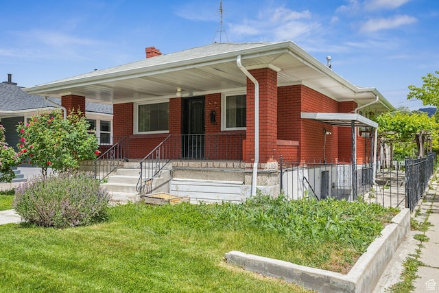 1435 S 500 E, Salt Lake City, UT 84105 - bungalow-style home featuring a chimney, brick siding, and fence