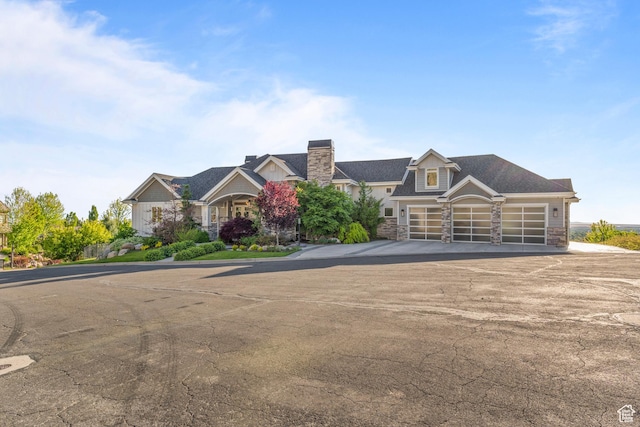 1769 View Ct, Fruit Heights, UT 84037 - view of front of home with stone siding, driveway, and an attached garage