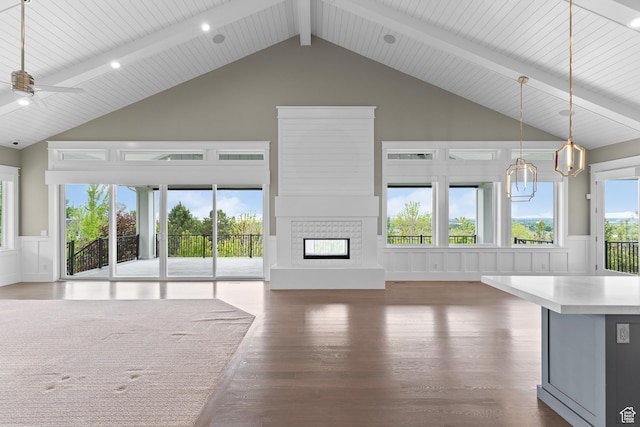 1769 View Ct, Fruit Heights, UT 84037 - unfurnished living room featuring wood finished floors, ceiling fan, beam ceiling, a glass covered fireplace, and high vaulted ceiling